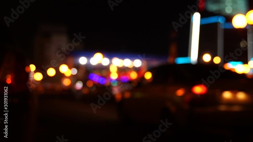Blurred bokeh traffic on the road at night in a big city.