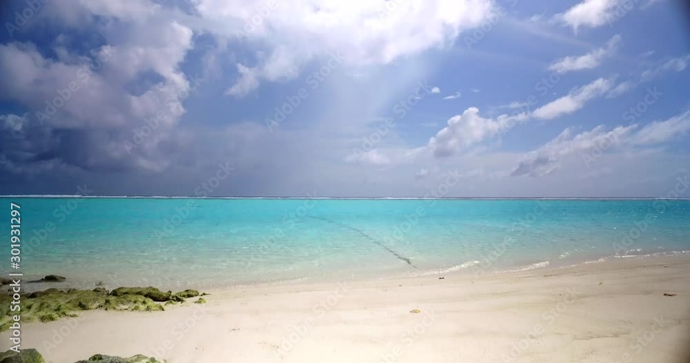 Bora Bora Island in French Polynesia - White Sand Kissed By The Crystal Clear Waters Under The Heat Of The Sun. Panoramic Shot Bora Bora Island in French Polynesia - White Sand Kissed By The Crystal Clear Waters Under The Heat Of The Sun. Panoramic Shot