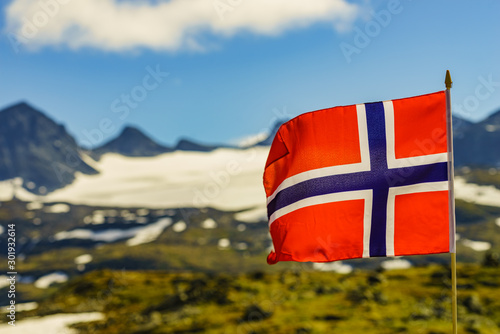 Norwegian flag and mountains snowy landscape