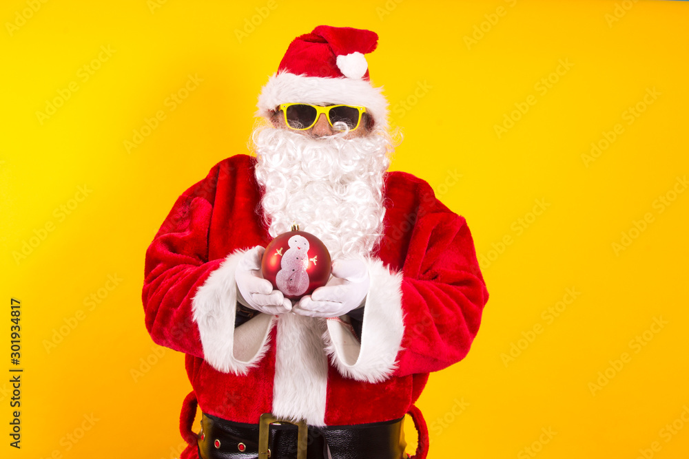 Santa Claus holding Christmas ball Santa Claus holding Christmas ball