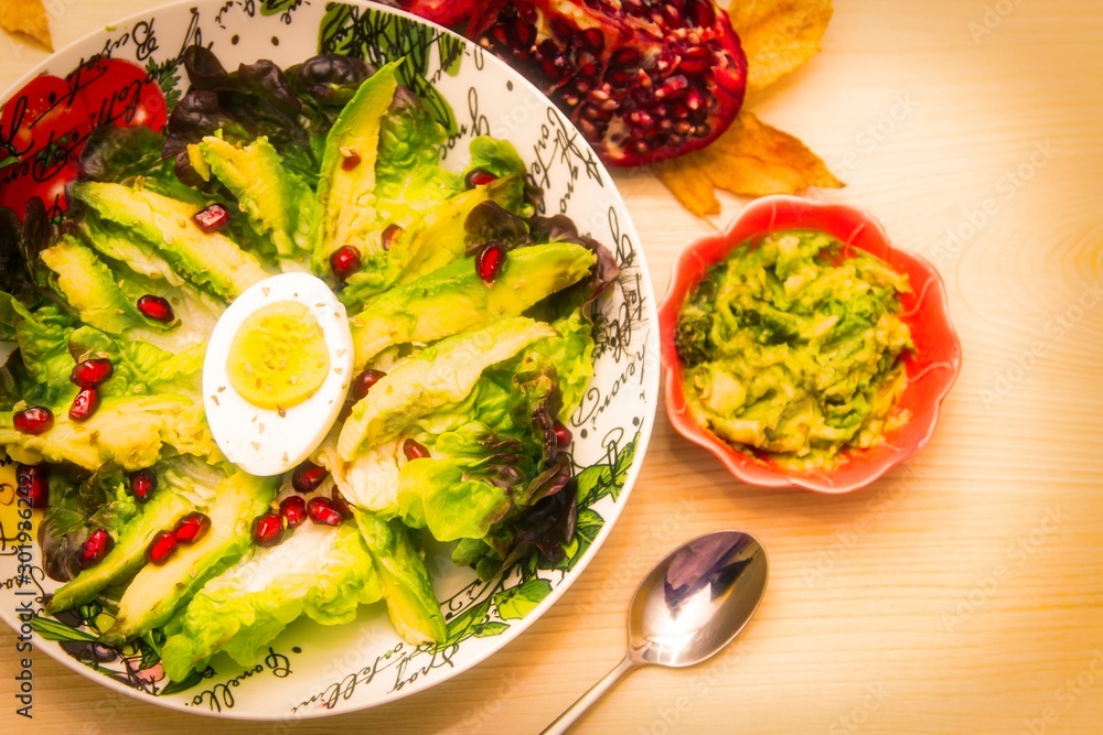 avocado, egg and pomegranate salad with guacamole