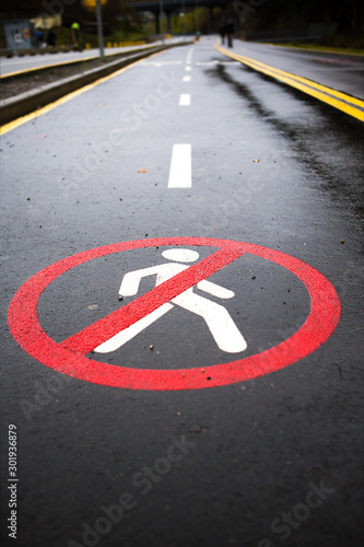 This sign indicates that pedestrians are forbidden to walk on this road. © fotodiya83