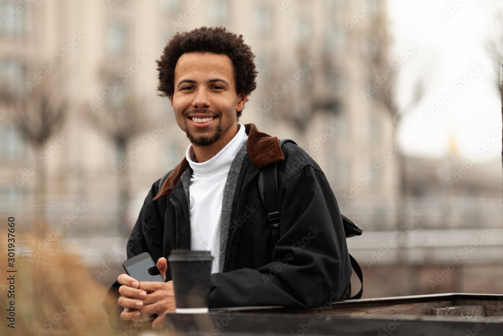 Hipster african man smiling outdoor. Hipster african man smiling outdoor.