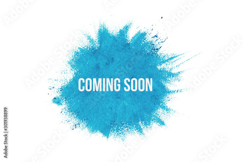 Coming soon on blue paint background, isolated on white. Advertising banner concept. photo