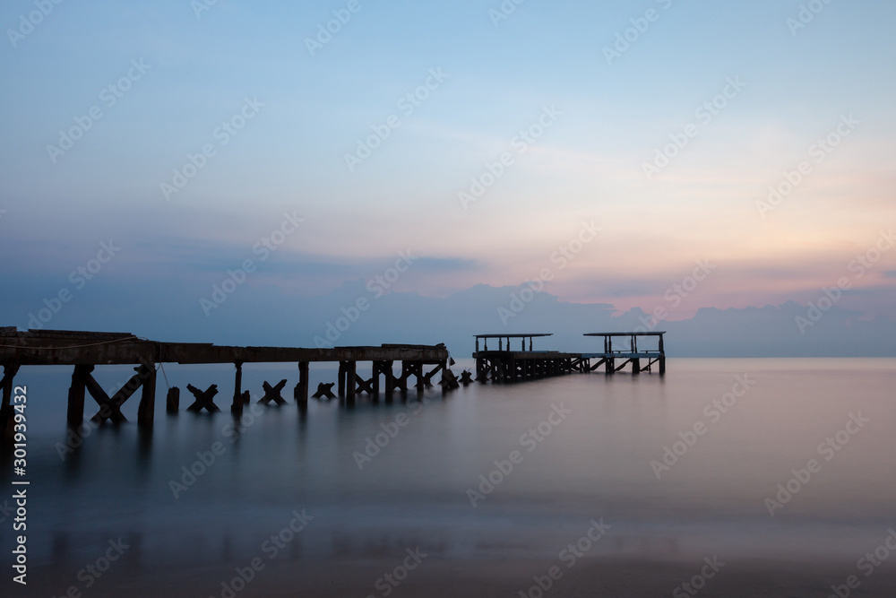 Old concrete bridges that melt on the beach by the sea in the morning, pastel tones, take long-exposure photos At Pran Buri Beach Prachuap Khiri Khan Province Thailand. Old concrete bridges that melt on the beach by the sea in the morning, pastel tones, take long-exposure photos At Pran Buri Beach Prachuap Khiri Khan Province Thailand.