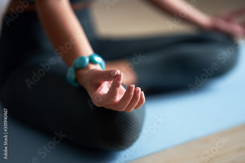 Adult woman practising yoga at home photo