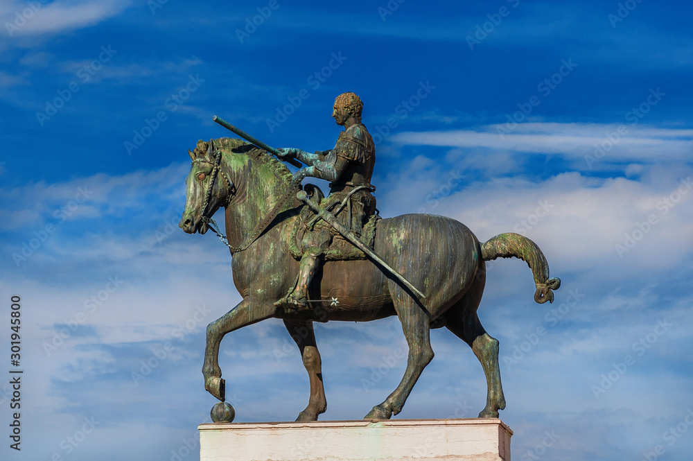Gattamelata bronze equestrian statue among clouds, in the historic center of Padua, erected by the famous renaissance artist Donatello in 1453