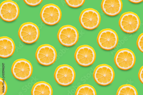 Food pattern of slices of fresh yellow lemon, healthy vegetarian fruit sour taste, healthy vitamin food