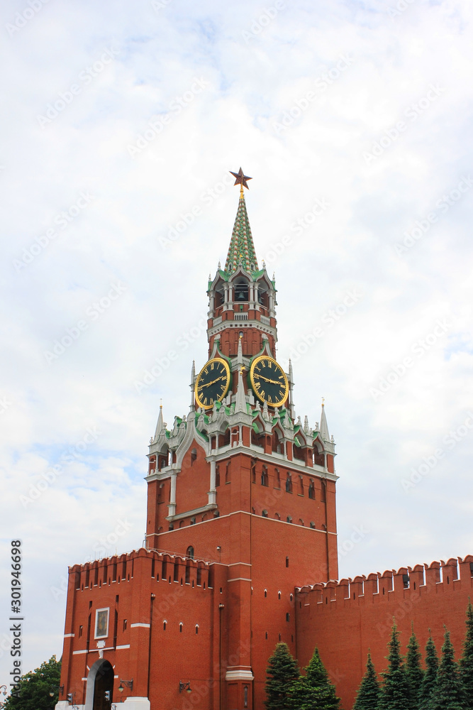 Spasskaya Tower of the Kremlin on Red Square in Moscow, Russia. Close up of Moscow downtown architecture, vertical view Spasskaya Tower of the Kremlin on Red Square in Moscow, Russia. Close up of Moscow downtown architecture, vertical view