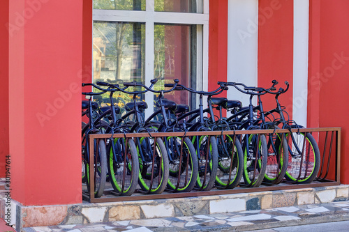 Parking identical bicycles near the building