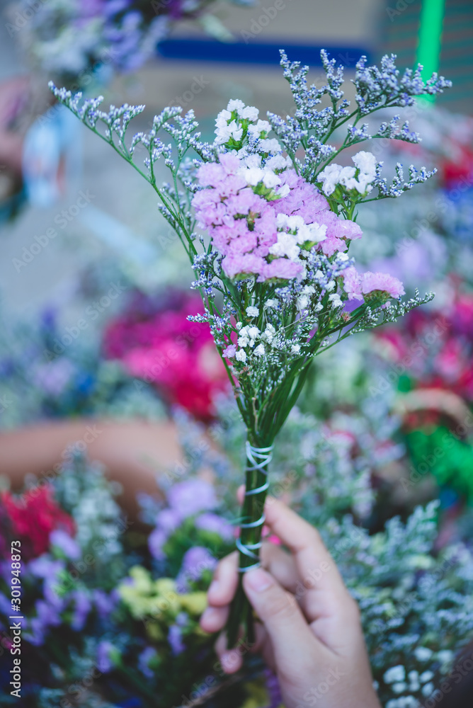 Bouquet of flowers made from dried flowers and dyeing a variety of beautiful colors for selling at festivals or congratulations on graduation occasions. Bouquet of flowers made from dried flowers and dyeing a variety of beautiful colors for selling at festivals or congratulations on graduation occasions.