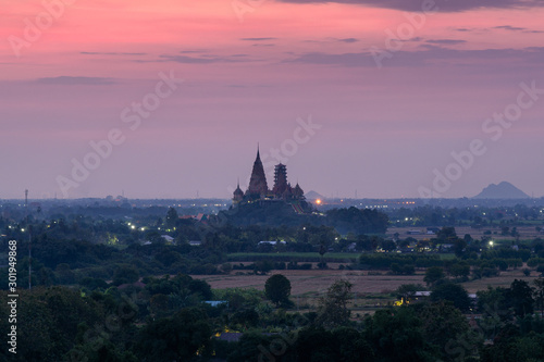 Wat Tham Sua temple on hill with colorful sky at dawn