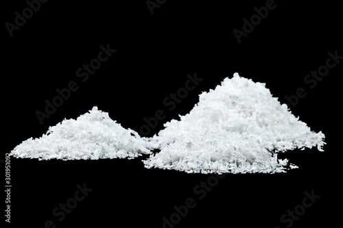 Pile of white snow isolated on black background