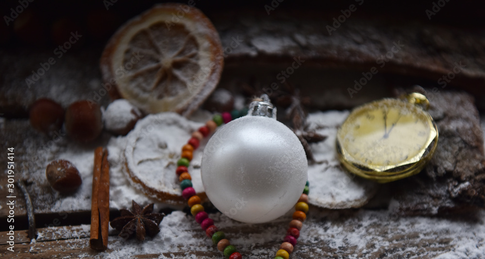 Christmas still life Christmas decorations balloon orange clock snow and powdered sugar Christmas still life Christmas decorations balloon orange clock snow and powdered sugar