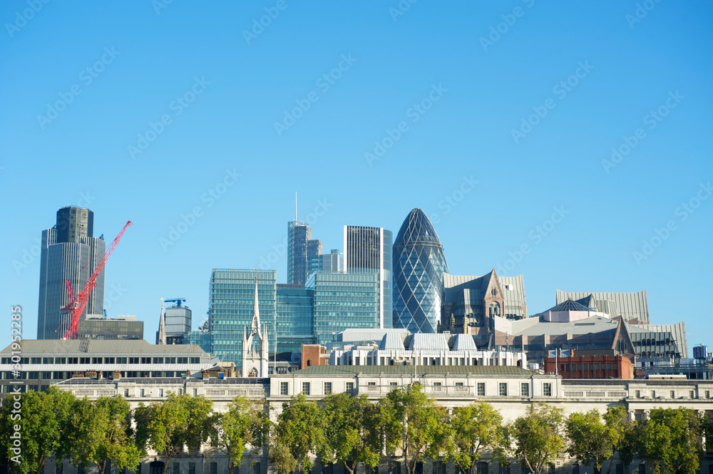 Blue sky view of the London city skyline on a bright summer afternoon
