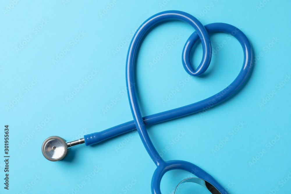 Stethoscope on blue background, space for text Stethoscope on blue background, space for text