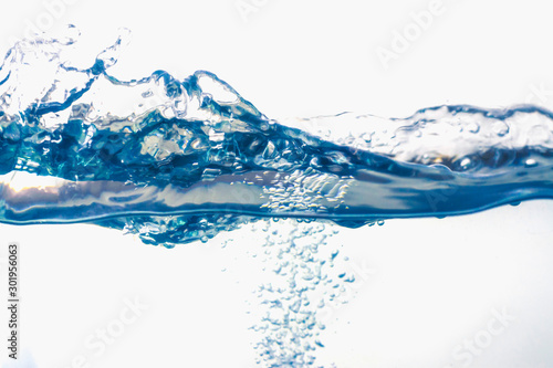 Water splash with bubbles of air  isolated on the white background.