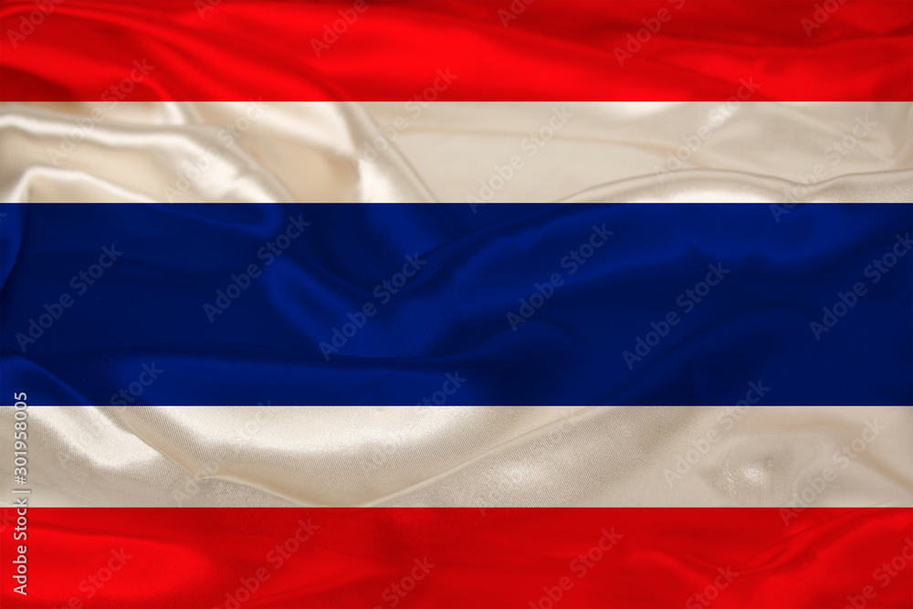 Fototapeta premium photo of the beautiful colored national flag of the modern state of Thailand on textured fabric, concept of tourism, emigration, economics and politics, closeup