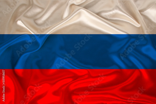 photo of the national flag of Russia on a luxurious texture of satin, silk with waves, folds and highlights, close-up, copy space, concept of travel, economy and state policy, illustration