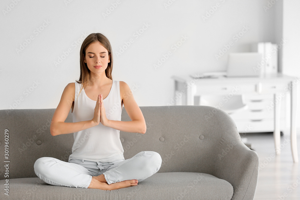 Young woman practicing yoga at home Young woman practicing yoga at home