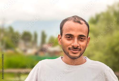 Photo of handsome Indian, asian youth with content and satisfied look. © blueaperture15