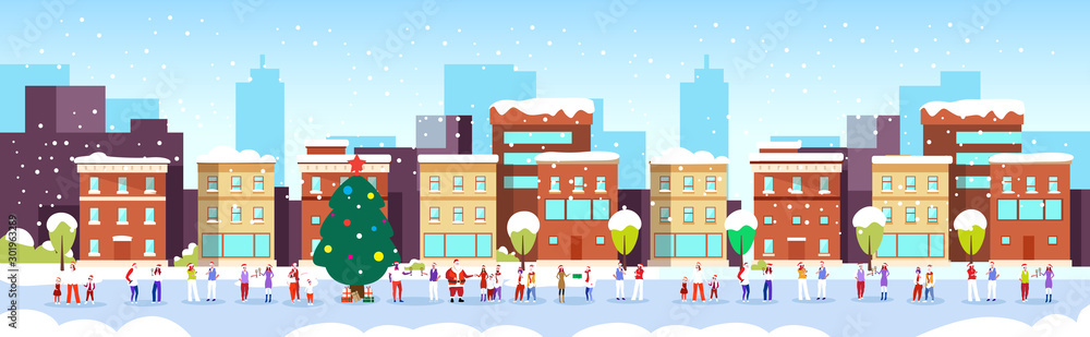 people celebrating merry christmas happy new year winter holidays concept men women wearing santa hats standing near fir tree modern city street cityscape background full length horizontal vector
