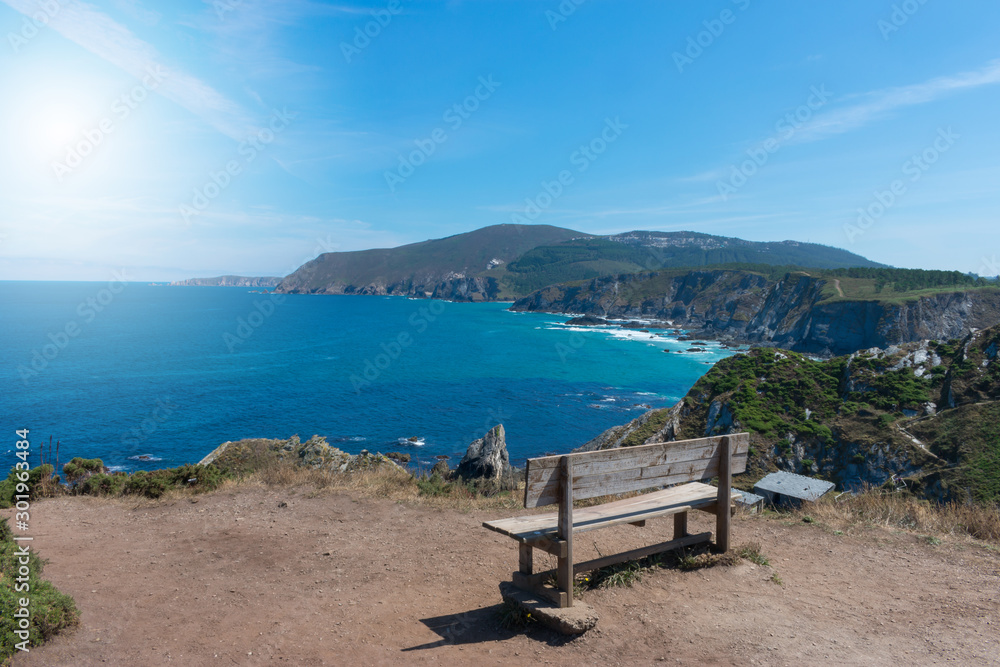 bench high on the cliff by the ocean