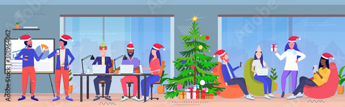 business people wearing santa claus hats using digital gadgets merry christmas and happy new year winter holidays celebration concept modern office interior full length horizontal vector illustration