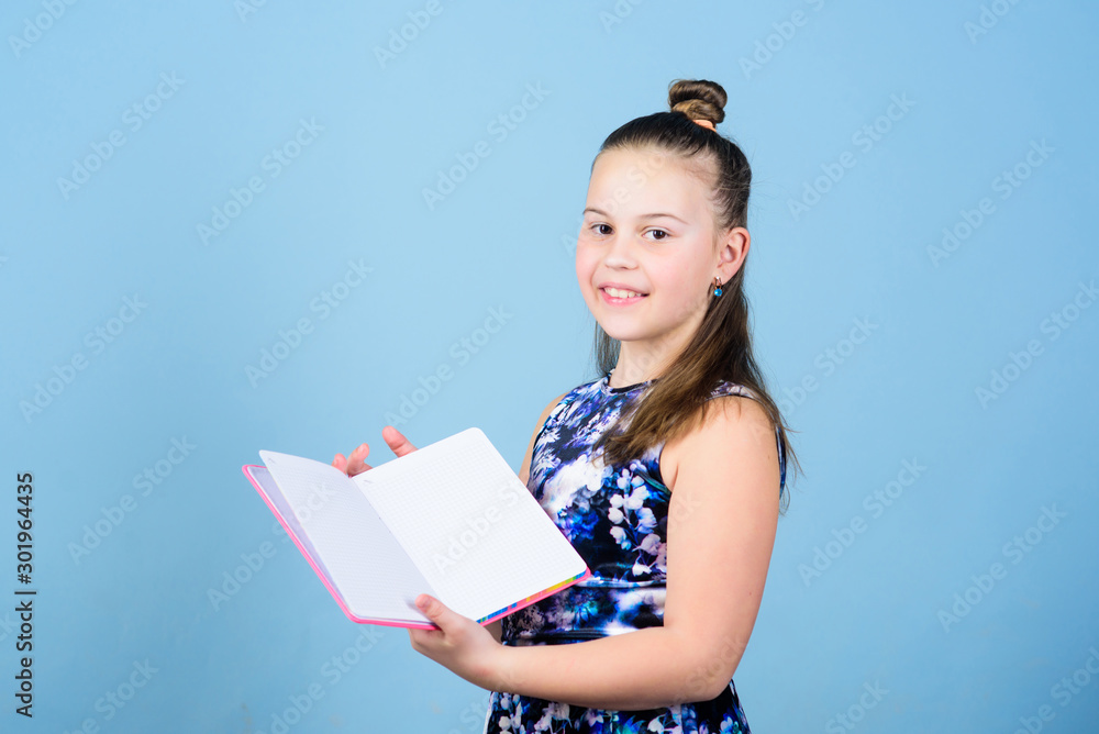 Keeping her secrets in diary. Child cute girl hold notepad or diary blue background. Childhood memories. Diary for girls concept. Note secrets down in cute girly diary journal. Keeping secrets here Keeping her secrets in diary. Child cute girl hold notepad or diary blue background. Childhood memories. Diary for girls concept. Note secrets down in cute girly diary journal. Keeping secrets here