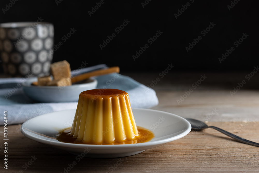 Homemade creme caramel desert on a dark background Homemade creme caramel desert on a dark background