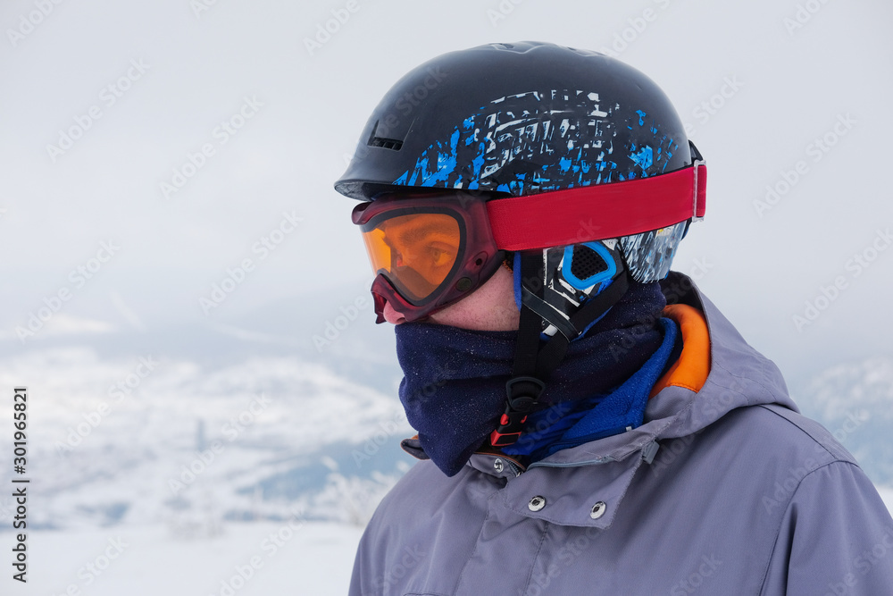 Young snowboarder riding in the mountains on a snowboard. Young snowboarder riding in the mountains on a snowboard.