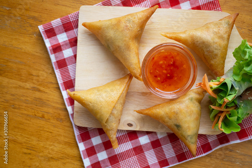Samosas on wooden board.Top view