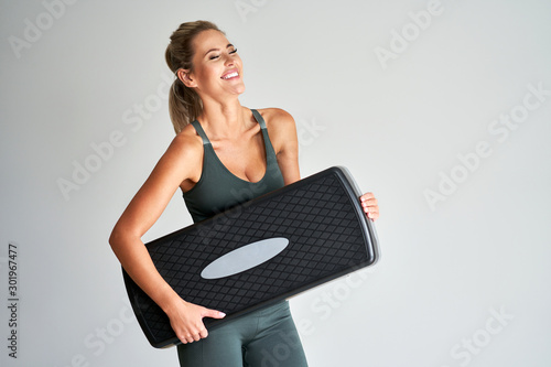 Adult woman working out with stepper