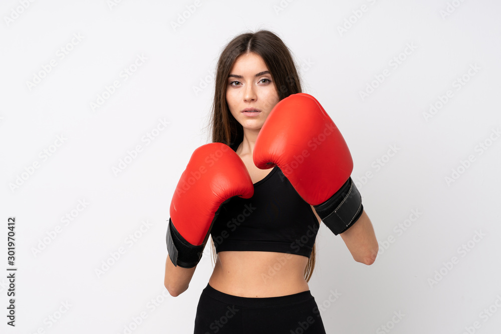 Young sport woman over isolated white background with boxing gloves Young sport woman over isolated white background with boxing gloves