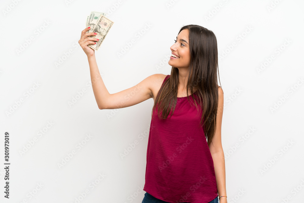 Young woman over isolated white background taking a lot of money Young woman over isolated white background taking a lot of money