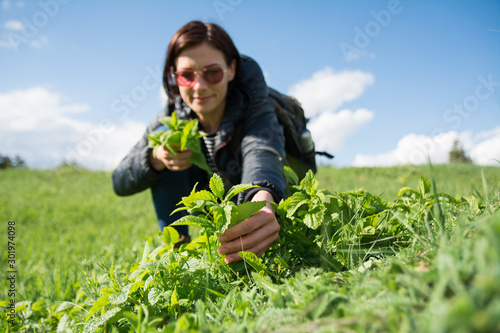 Wallpaper Mural Female hiker picking mint outdoor Torontodigital.ca