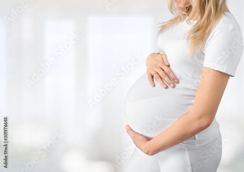 Pregnant young woman keeps the stomach Free Download Pregnant young woman keeps the stomach - GFXLoad