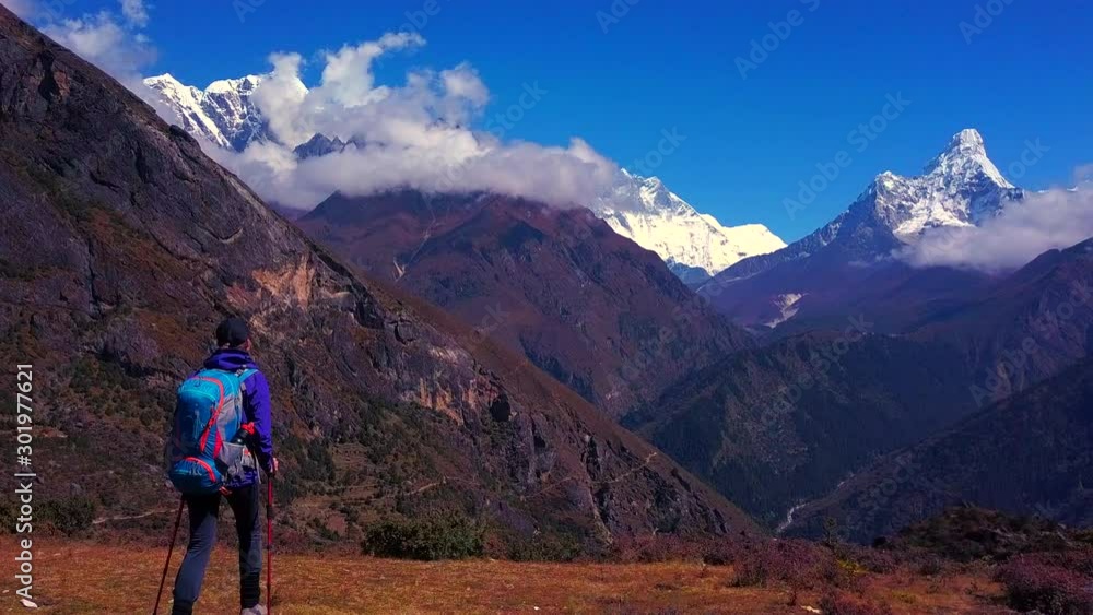 Active hikers enjoying the Ama Dablam mount view at Himalaya mountains landscape in trail to Everest base camp Active hikers enjoying the Ama Dablam mount view at Himalaya mountains landscape in trail to Everest base camp