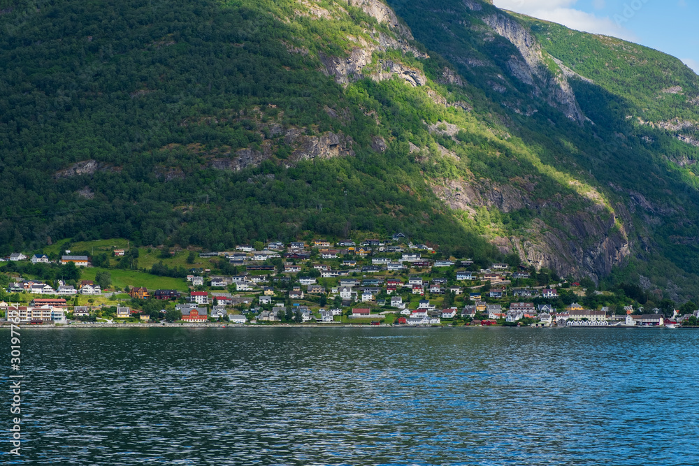 The village of Aurlandsvangen at the coast of the Sogne fjord Aurlands fjord at Norway. July 2019