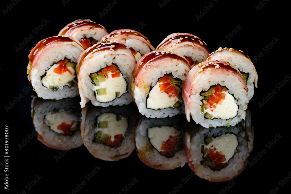sushi set on a black mirror background sushi set on a black mirror background
