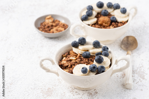 Granola, oatmeal with banana and berry food background