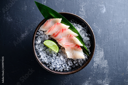 Sashimi Japanese food, slices of sashimi perch on ice. Sliced fish in an expensive restaurant photo