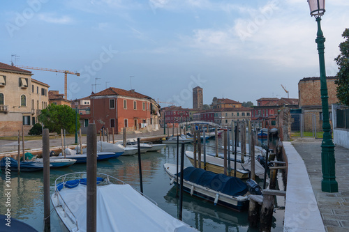 Old buildings in Murano. Canal view with boat. Travel photo. Italy. Europe.