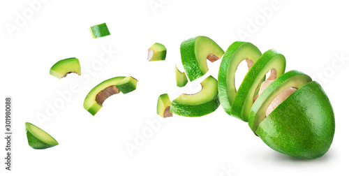 Avocado sliced and falling isolated on a white background
