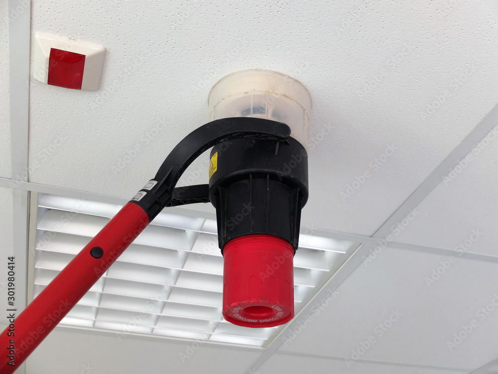 Narva, Estonia  03.04.2019 , Office room . Fire alarm system service. Professional Smoke Detector Tester 