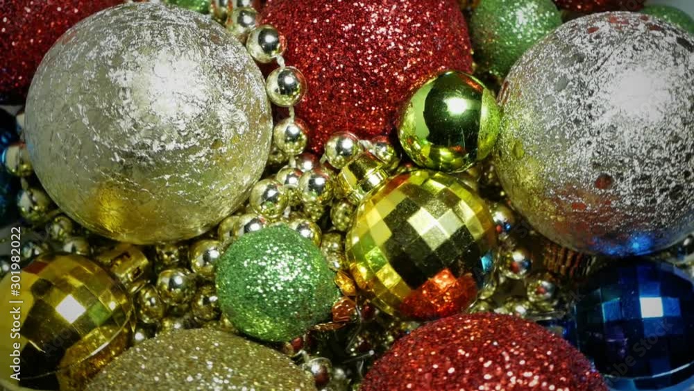 Close-up of a rotation of multi-colored Christmas balls Close-up of a rotation of multi-colored Christmas balls