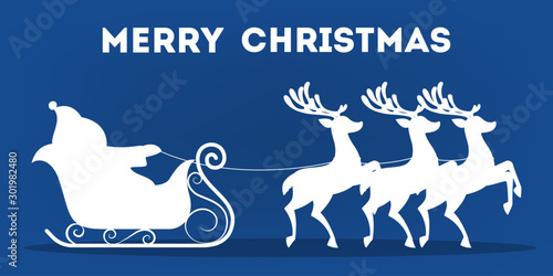 Santa Claus in sleigh and running deer