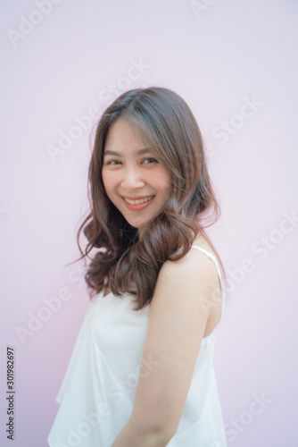 Beautiful asian women portrait posting on pink background