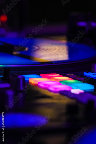 DJ vinyl players in dark nightclub, turntables