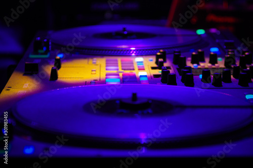 DJ vinyl players in dark nightclub, turntables